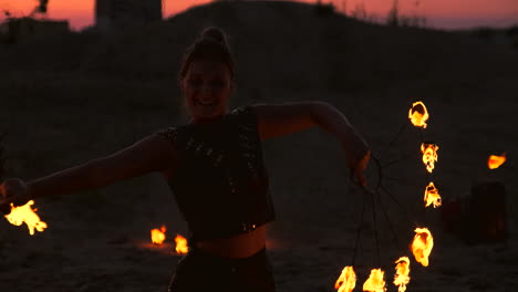 Fire-show-artist-breathe-fire-in-the-dark-at-abandon-building-slow-motion.-Fire-in-heart-shape.